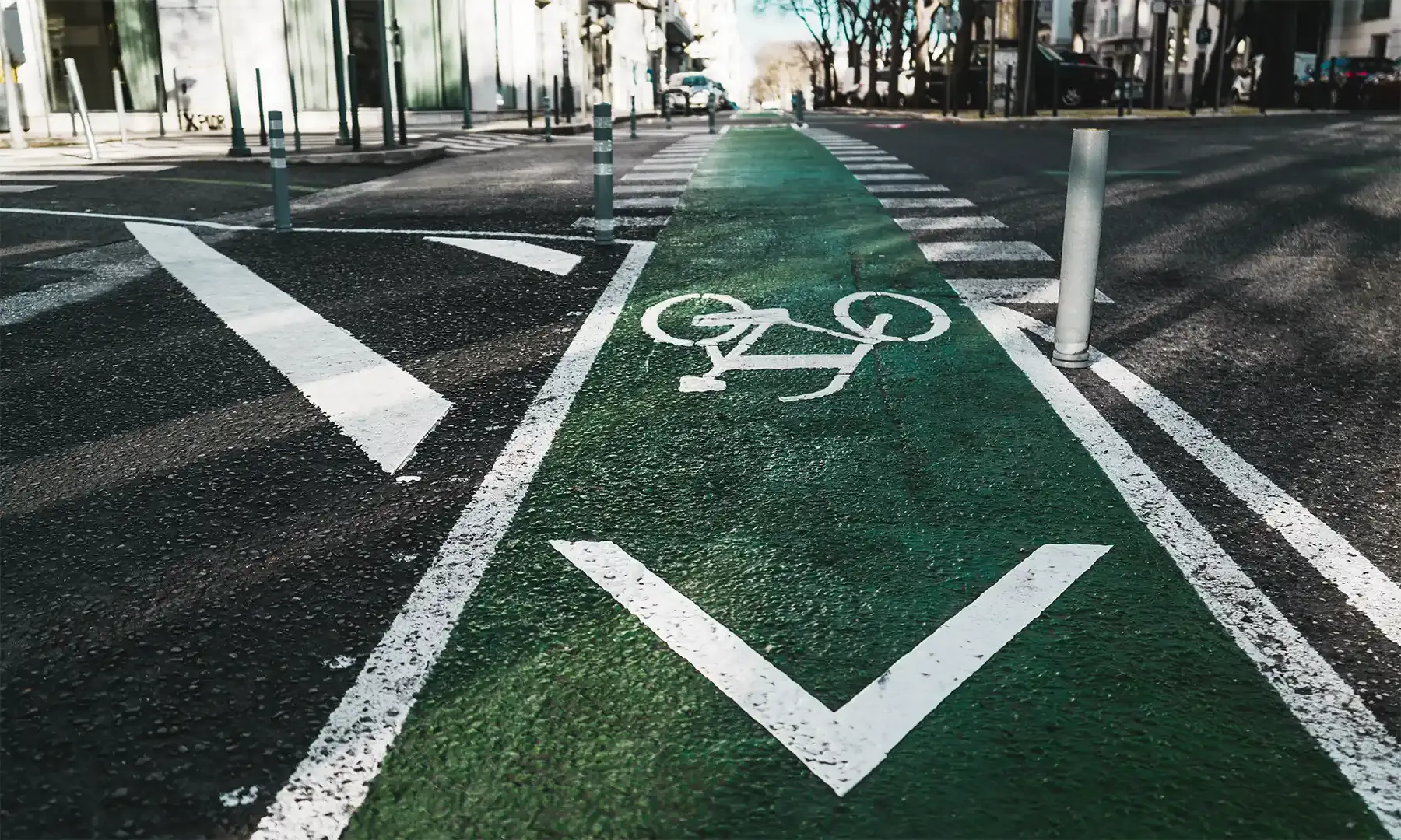 A green protected bike lane on a city street